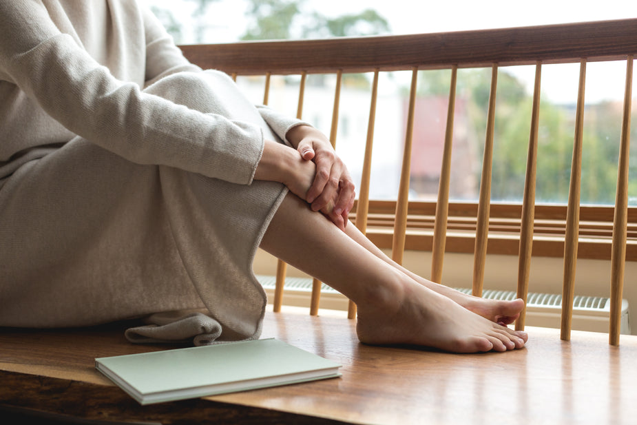 woman-resting-her-feet-by-the-window.jpg